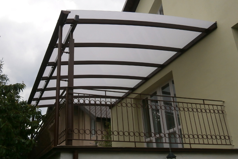 White awning with a balcony underneath it