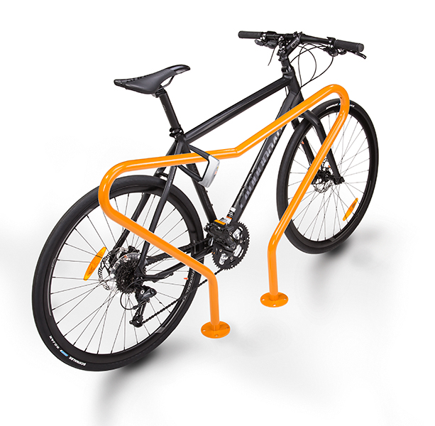 A bike locked to a rack of orange irregular shape.